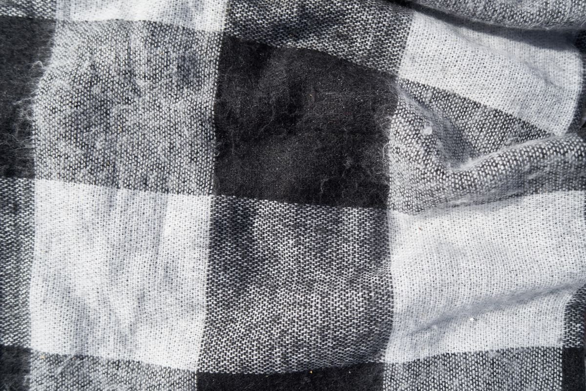 Grey and white checked wool blanket